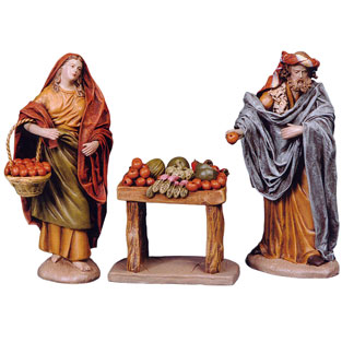 Nio vendiendo fruta y pastora