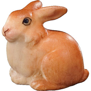 Pequeo conejo sentado en talla de madera de ...