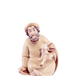 Pastor sentado con cordero artis